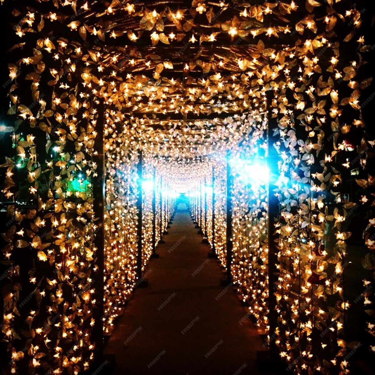 Think twinkling fairy lights woven through floral arrangements